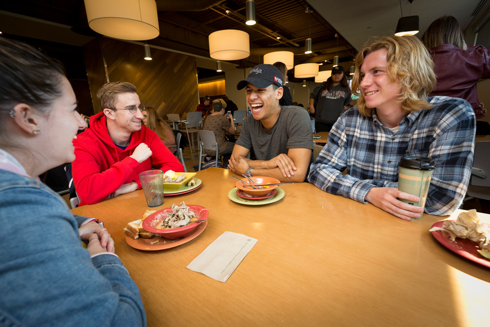 Students sitting at a table in the Cub Cafe