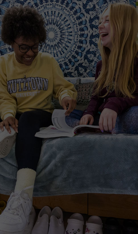 two students studying in a residence hall room