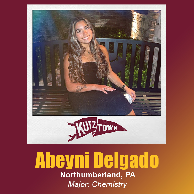 Abeyni Delgado sitting on a bench with her name and major, chemistry, listed below her picture