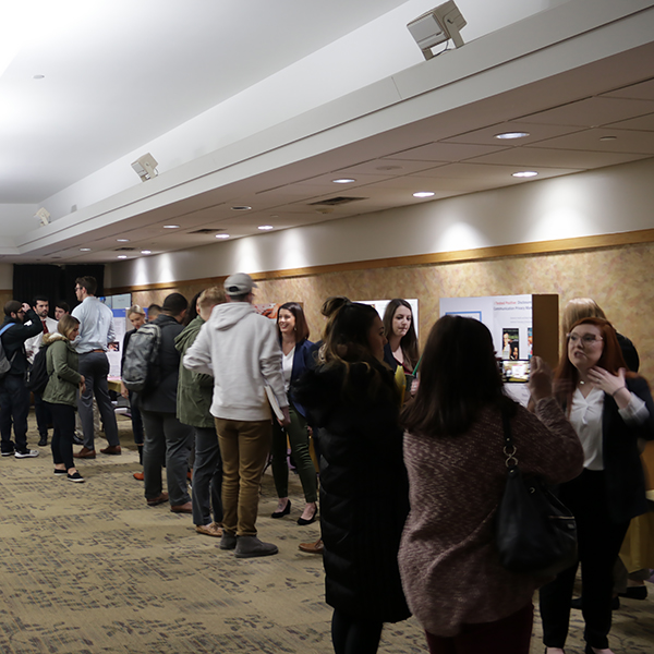 Students conversing at a poster conference