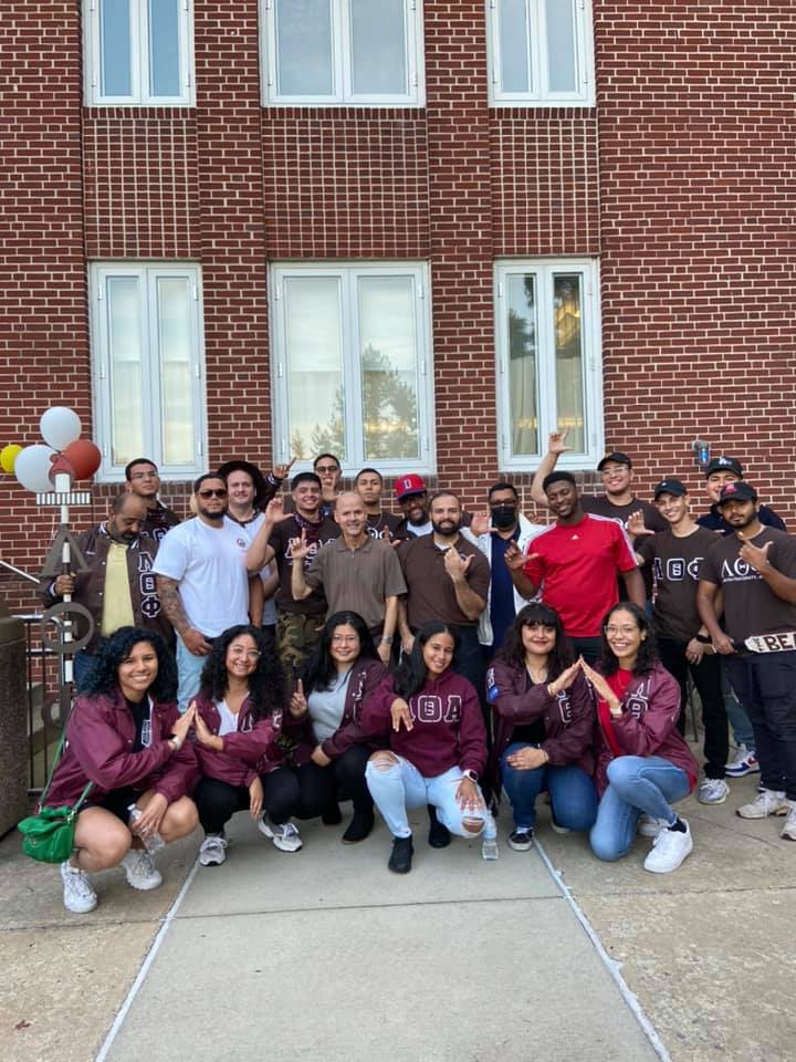 Lambda Theta Phi members posing for group picture outside of Multicultural Center