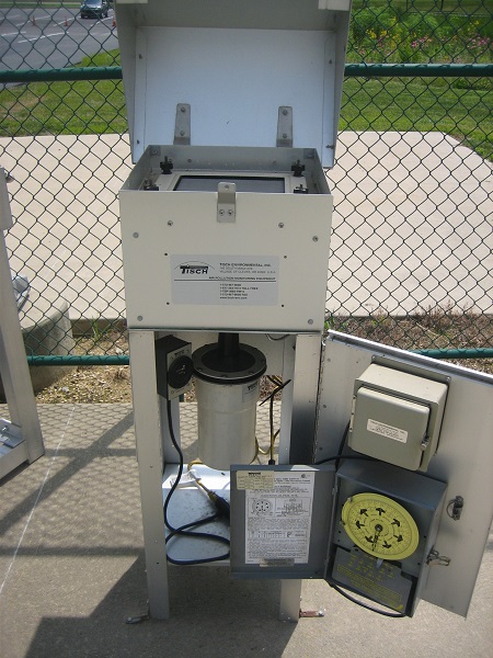 hi-volume air sampler with hood open and circle chart pump shown behind bottom door