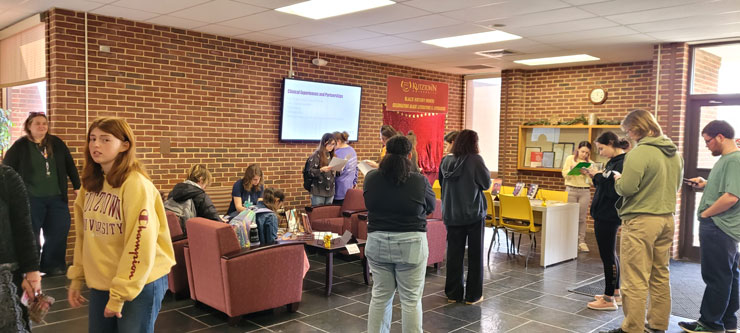 Students and facutly in Beekey lobby during Black Literature event