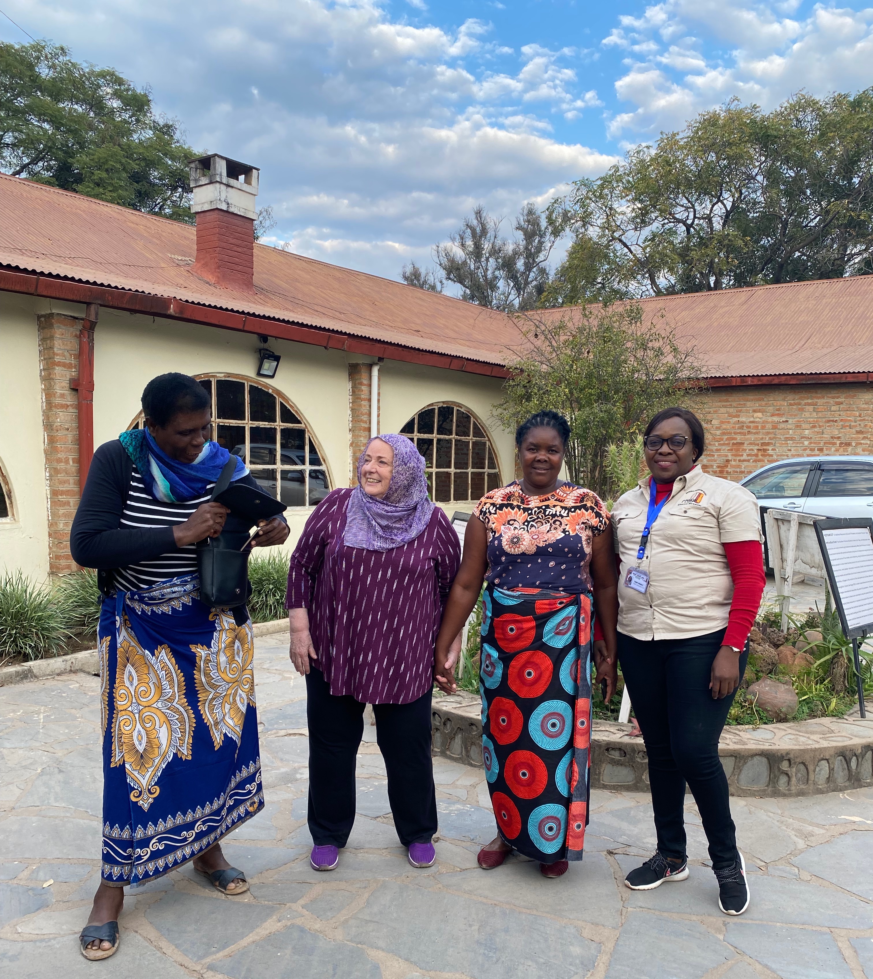 Dr. Chris Saidi and tribal elders standing together in Zambia Africa