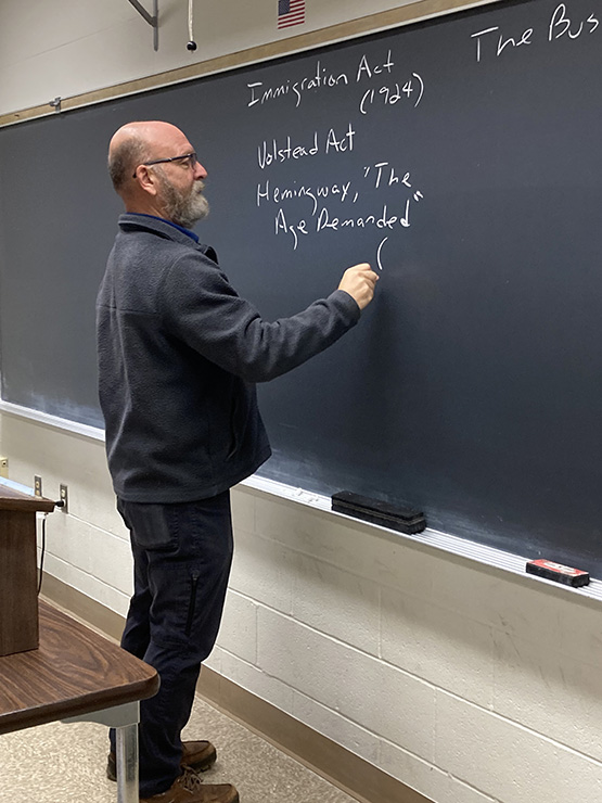 Dr. Gambone writing on the chalk board