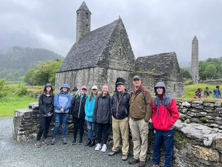 Students and Dr. Johnson standing in front of ruins in Antheny Ireland