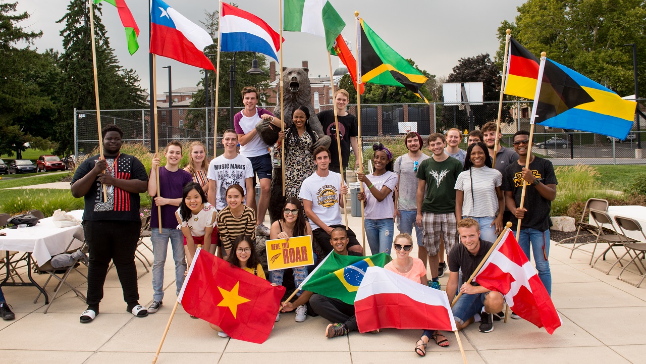 New international students holding their flags