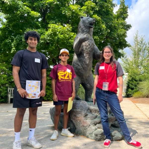 Students on North Campus by the bear statue