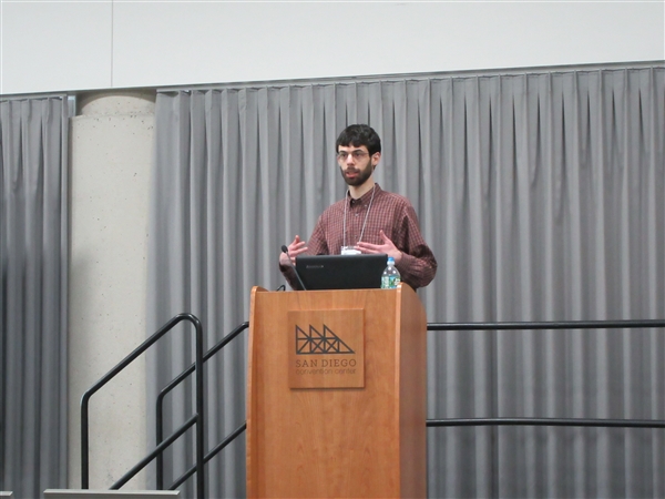 Faculty member presenting at a conference