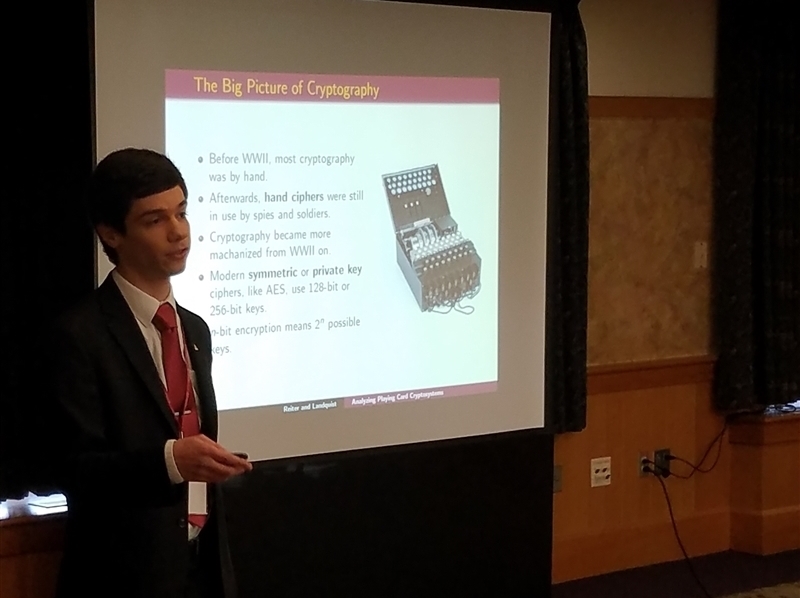 Student presenting his research at a conference