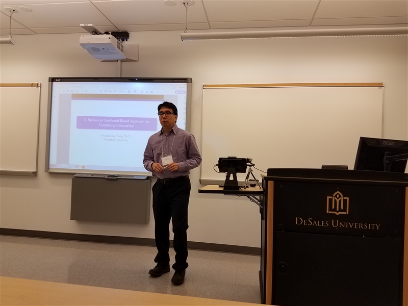 Faculty research presentation at a conference