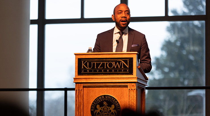 Cornell William Brooks, man in suit at lectern giving speech