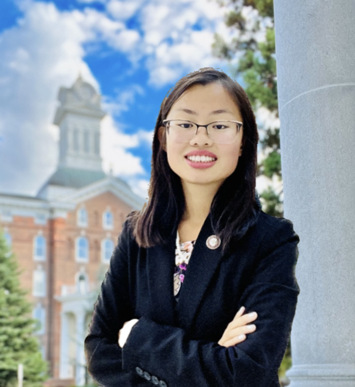 Photo of student Elizabeth Kolb in front of Old Main clock tower.
