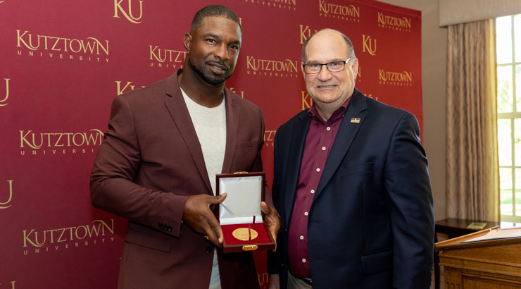 The most recent recipient of KU's President's Medal, Jonn Mobley with President Hawkinson