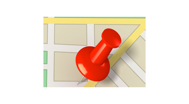 closeup on a push pin in a map 