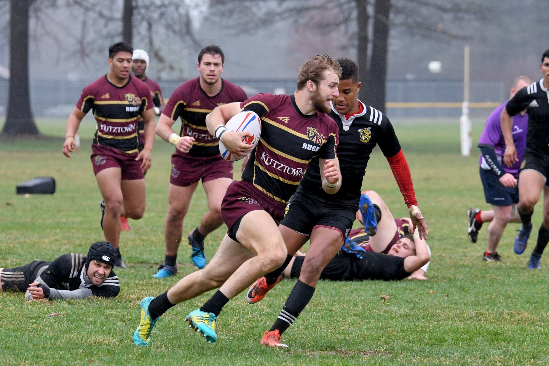 Men's Rugby player running with the ball