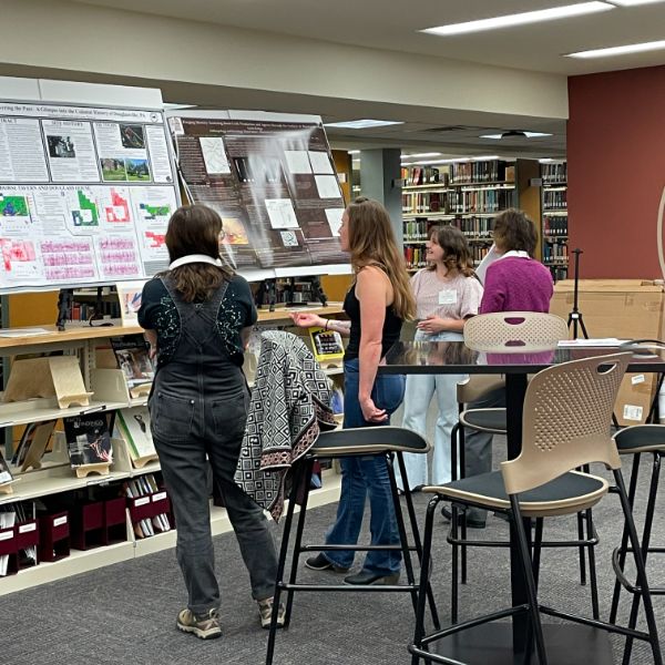 Students looking at posters in the Rohrbach Library