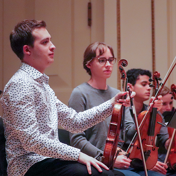 Students rehearsing at Weill Hall within Carnegie Hall.