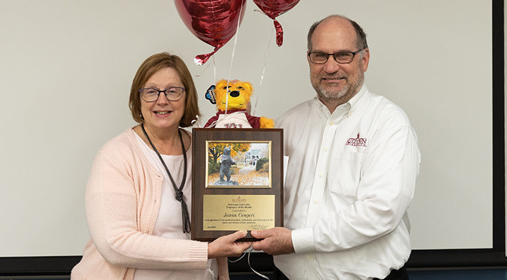 Cengeri presented with awards from President Hawkinson