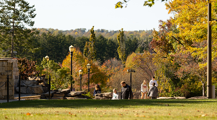 Students walking on campus in fall