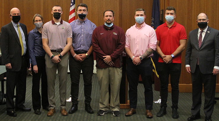 Members of KU football team recognized.