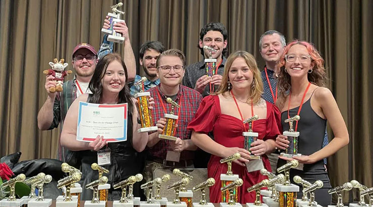 Students holding awards.