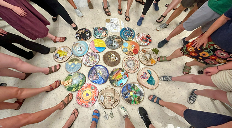 Artwork on floor with feet of artists