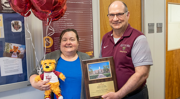 Hawkinson presenting award to Manwiller