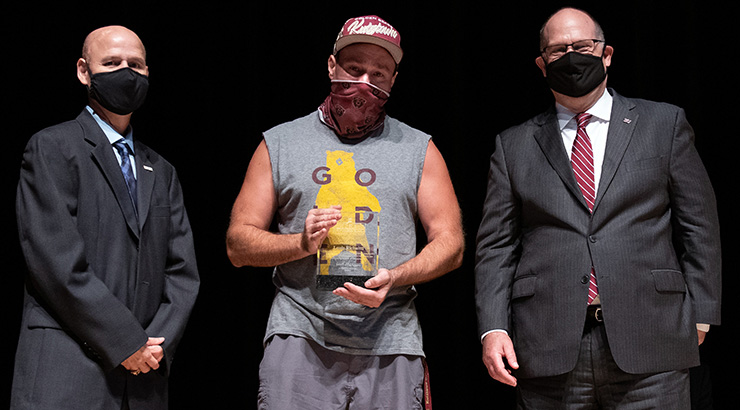 Pena and Hawkinson presenting Richuitti with award.