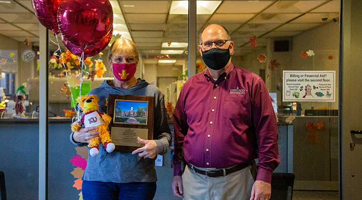 Shirk accepting award from President Hawkinson.