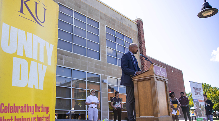 McCargo speaking at podium on stage at 2019 Unity Day.