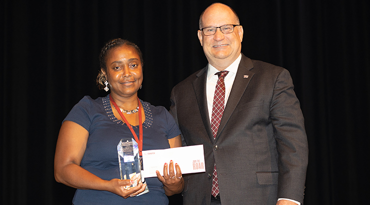 Vlaun accepting award from President.