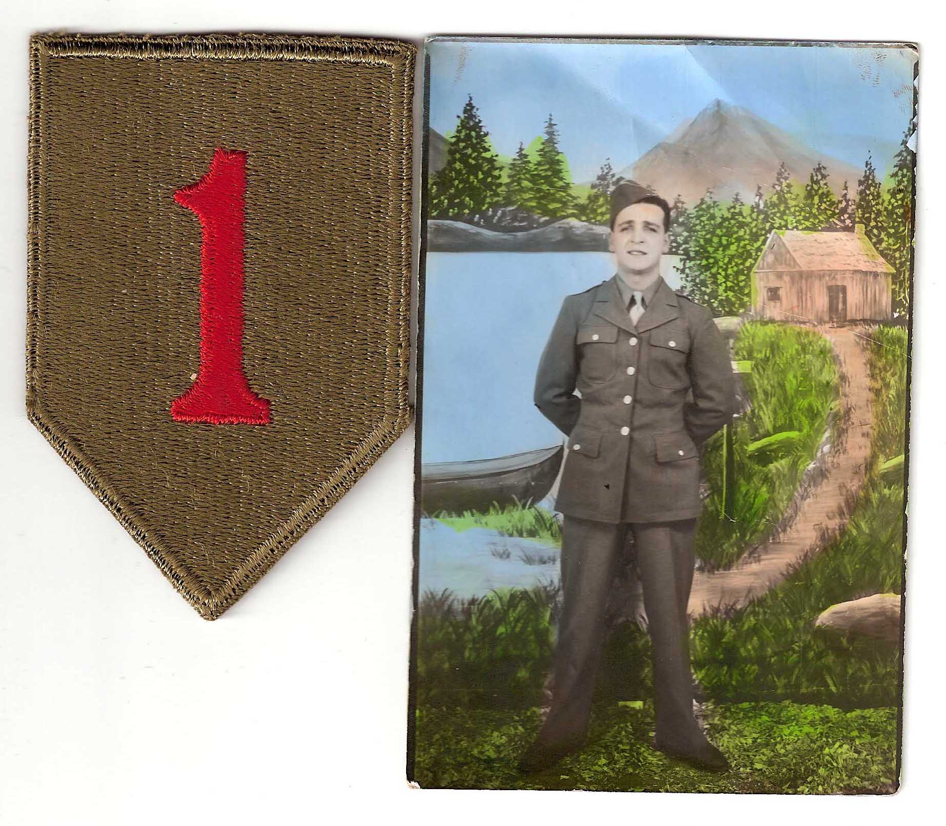 A picture of the 1st Division patch, also known as 'the Big Red One," and a picture of PFC Eake DeMarco in uniform standing in front of a body of water with a mountain in the background.