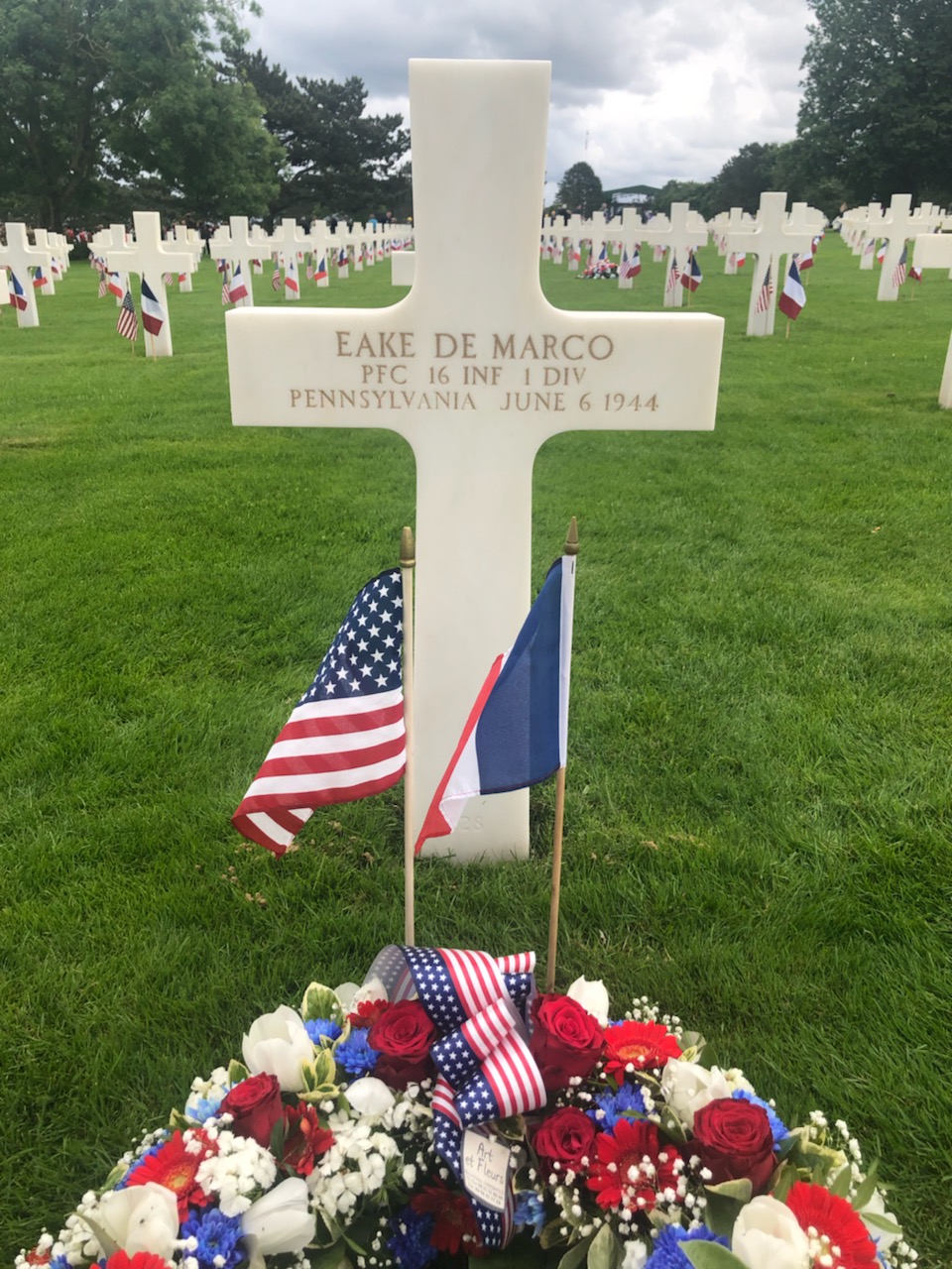 A picture of Private First Class Eake DeMarco's gravesite in St. Laurent, France, U.S. Military cemetery.