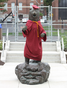 bear statue wearing a cap and gown