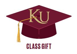 Maroon graduation cap with KU written on top and class gift written underneath the cap