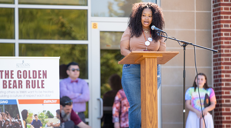 Student speaking on stage.