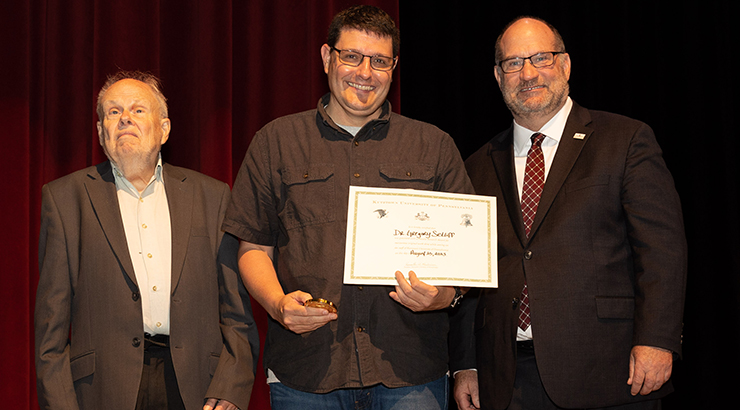 Setliff receiving award on stage