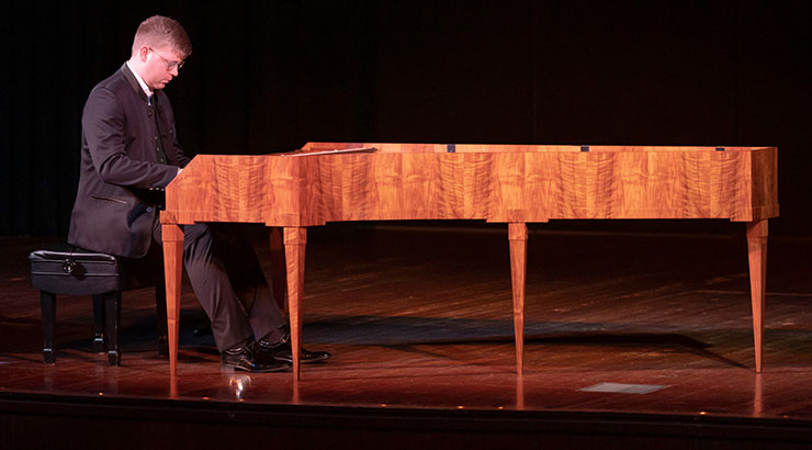 Pianist performing on stage