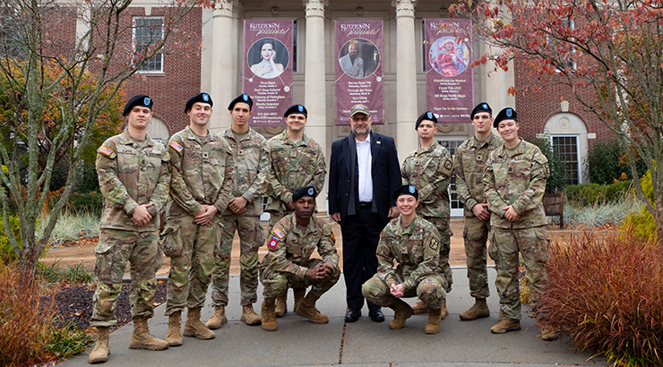 Group photo in front of flagpole