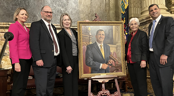 Group photo on House floor with portrait