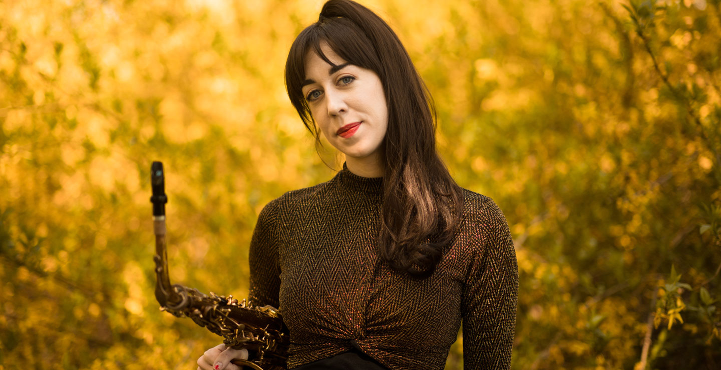 Marybeth Kern holding a saxophone