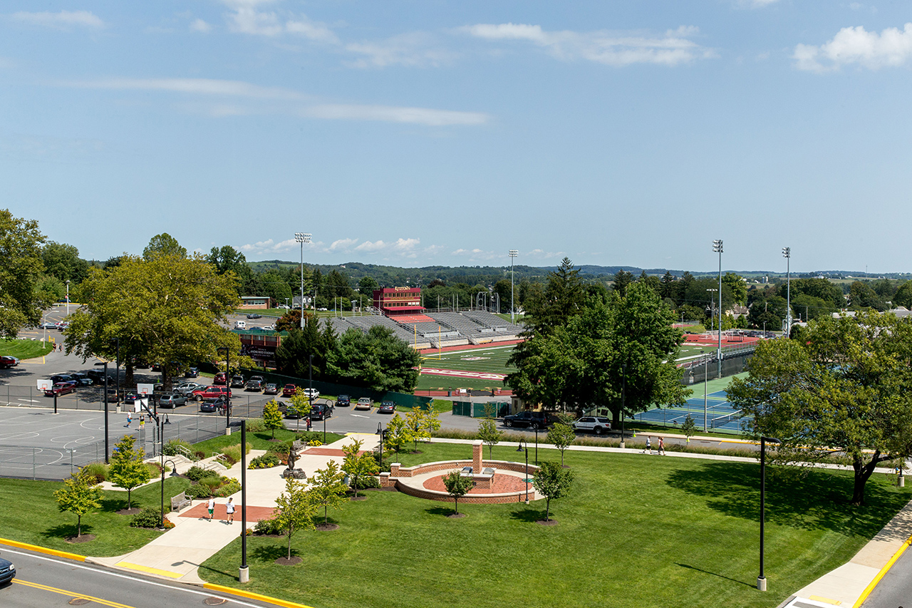 Overhead shot of the golden bear plaza in the foreground, with the football field in the background 