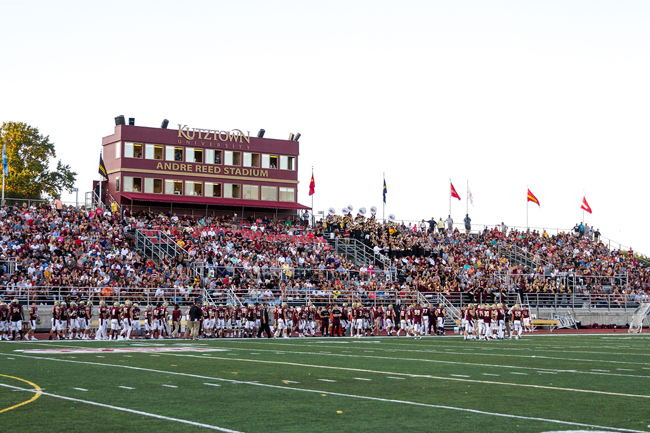 wide shot of full bleachers at Andre Reed Stadium, with the box seats overhead 