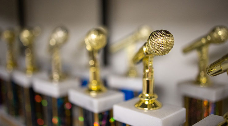 series of trophies in the shape of microphones
