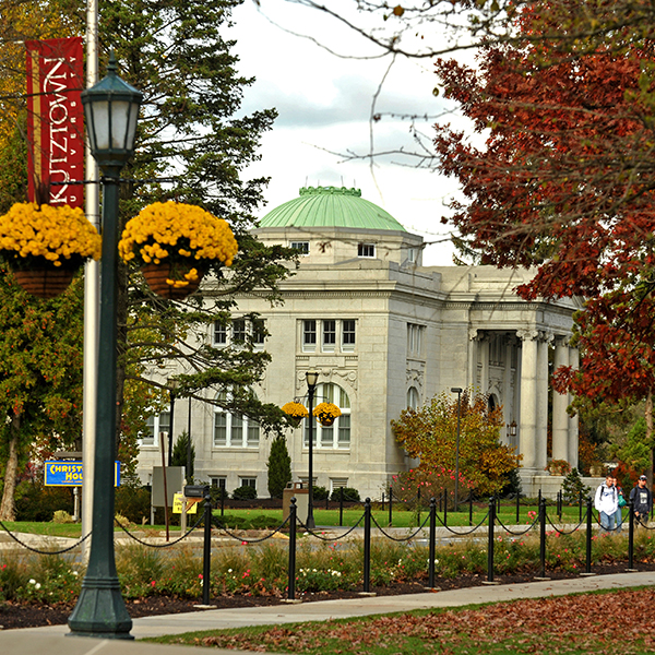 side of graduate center with fall leaves