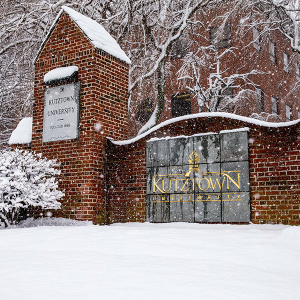 kutztown sign with snow falling