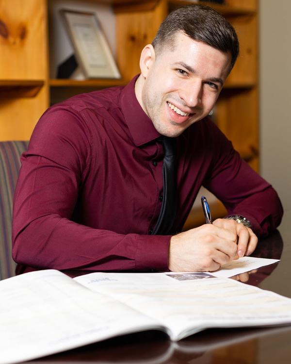 Master of Business Administration student conducting business at desk.