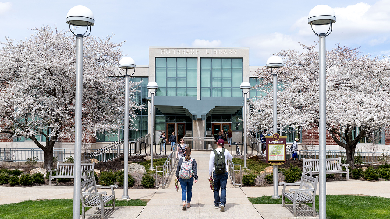 Students walking in front of Rohrbach Library.