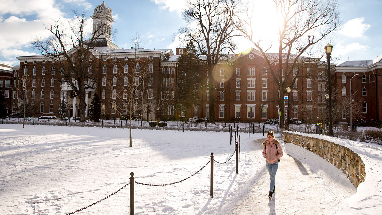 Old Main in winter with snow.